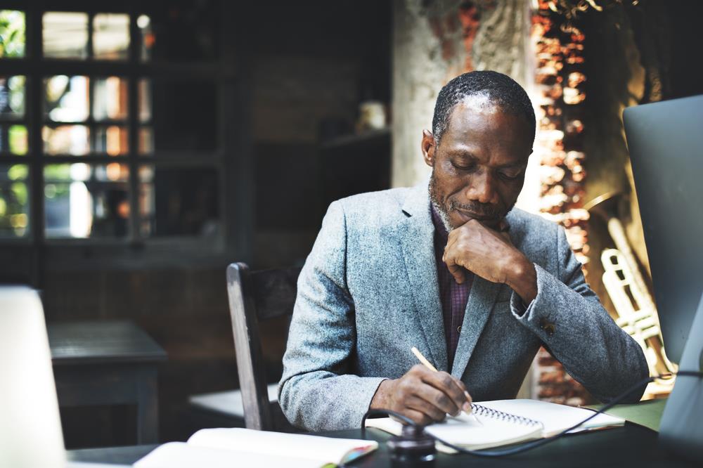 Man working at his home desk 