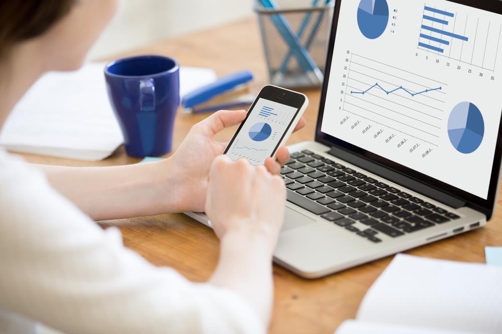 Woman reviewing data in her home office