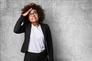 Woman making unhappy face with hand on head