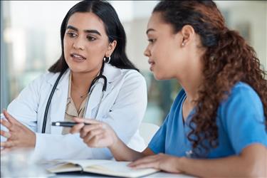 doctor and nurse having a meeting at a desk