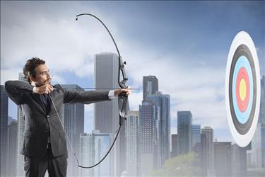 Job seeker with bow and arrow aiming at a target