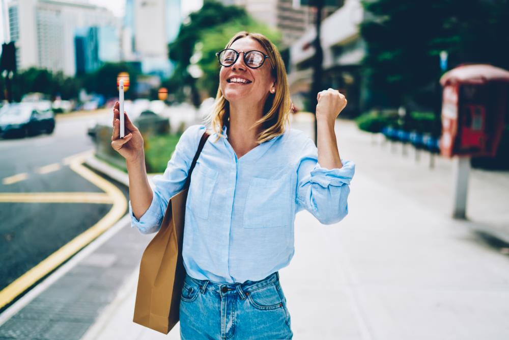 Woman cheering after landing her dream job