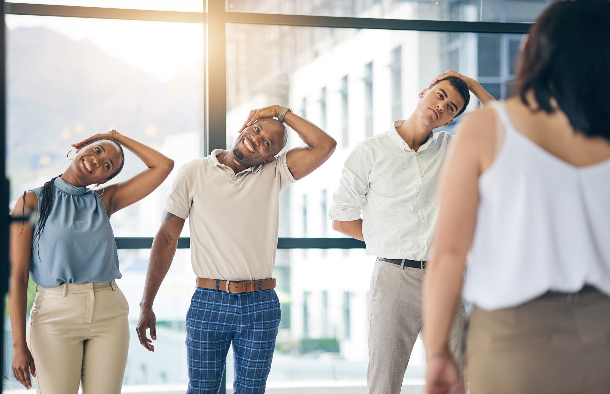 group of employees stretching together