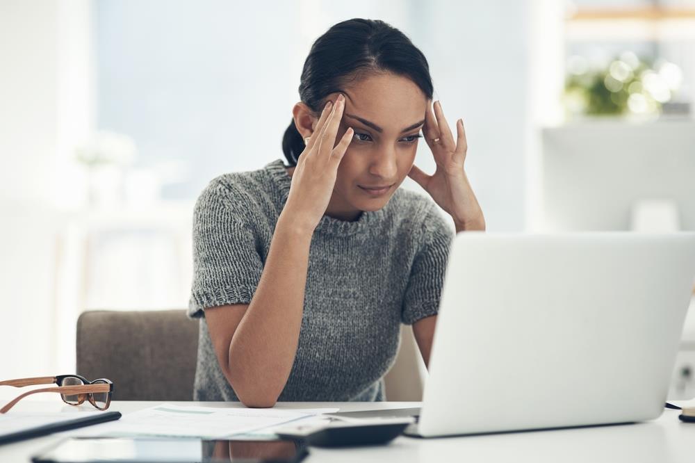 new employee frustrated at her desk