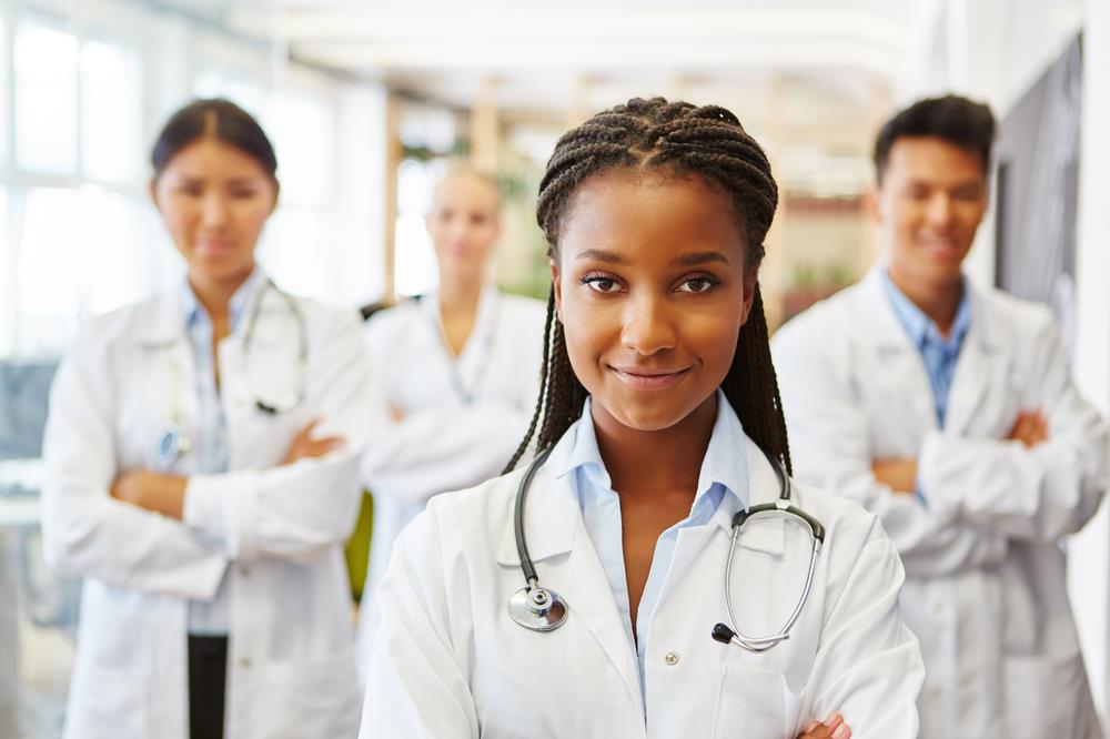 Young ophthalmologist with group of fellows