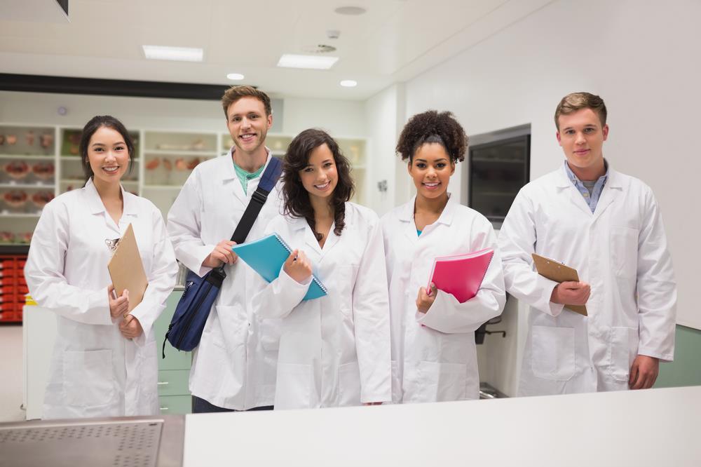 Group of medical students smiling in a classroom