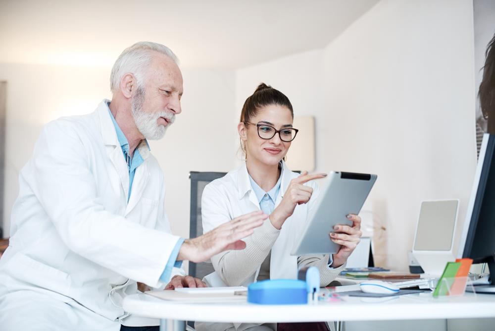 two optometry team members reviewing a resume