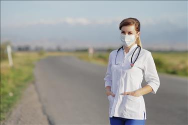 doctor standing on a rural road
