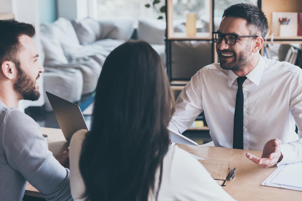 financial advisor meeting with his clients