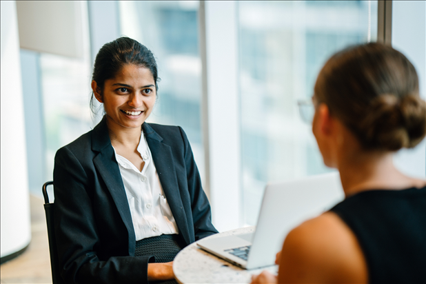 A hiring manager and a candidate engaged in an interview