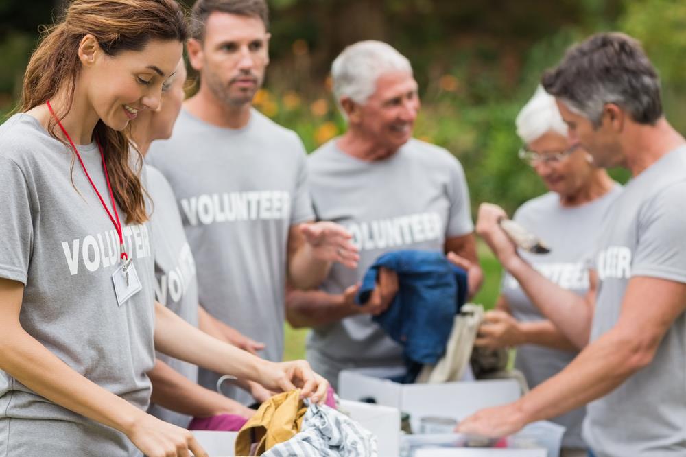 employees volunteering together to sort donations