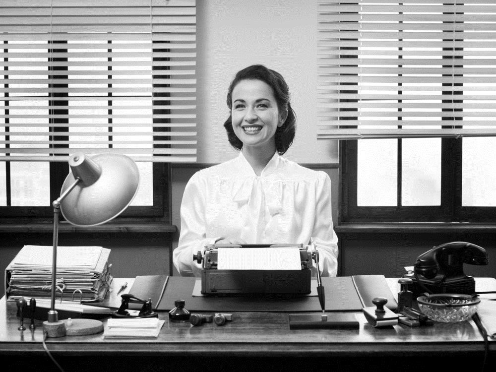 Black and white photo of a secretary, which is an outdated job title