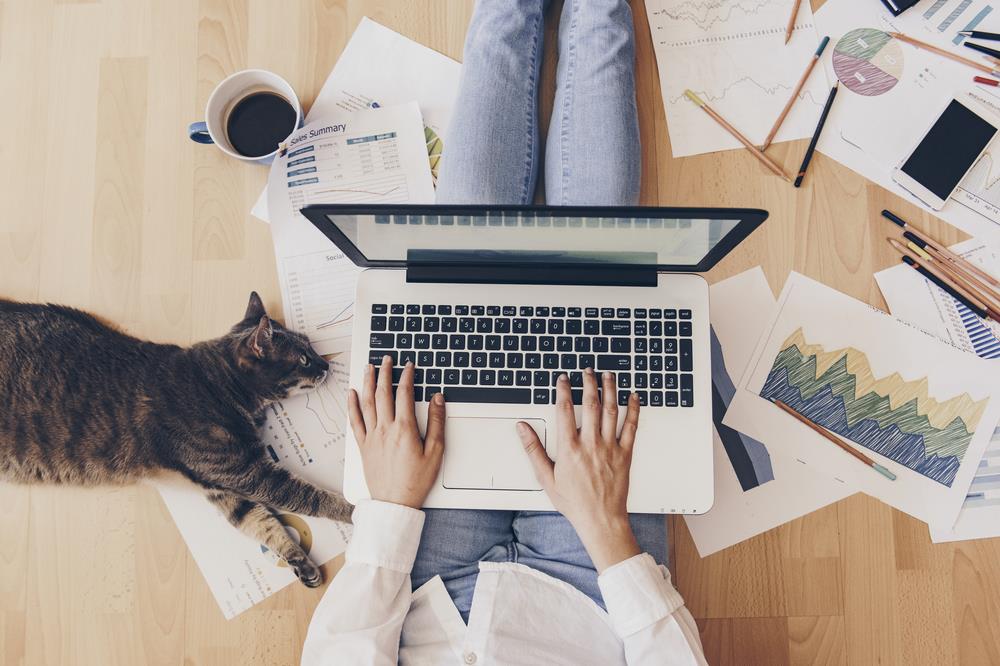 Woman working from home on floor