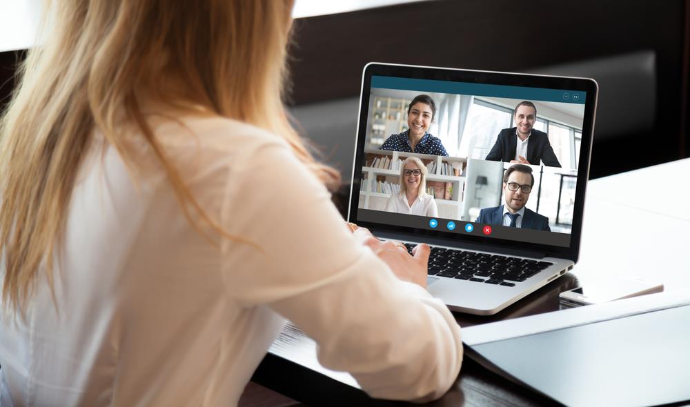 employee creating a safe work environment by holding a virtual meeting