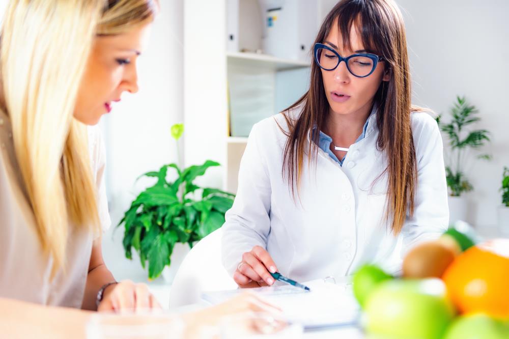 Dietitian advising patient on their nutritional plan