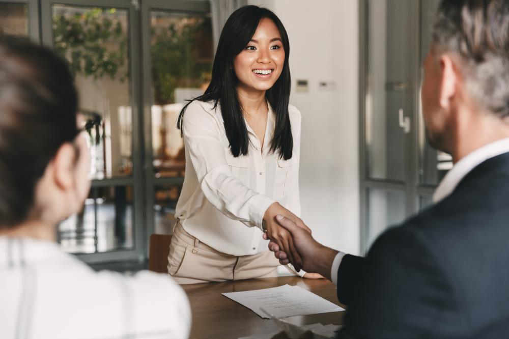 young woman shaking hands