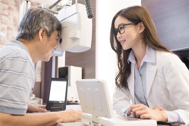 optometrist conducting patient's eye exam