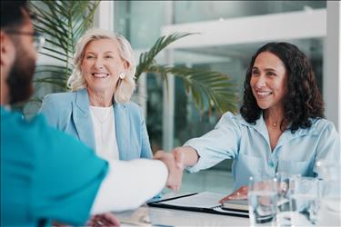 healthcare job seeker shaking hands during an interview