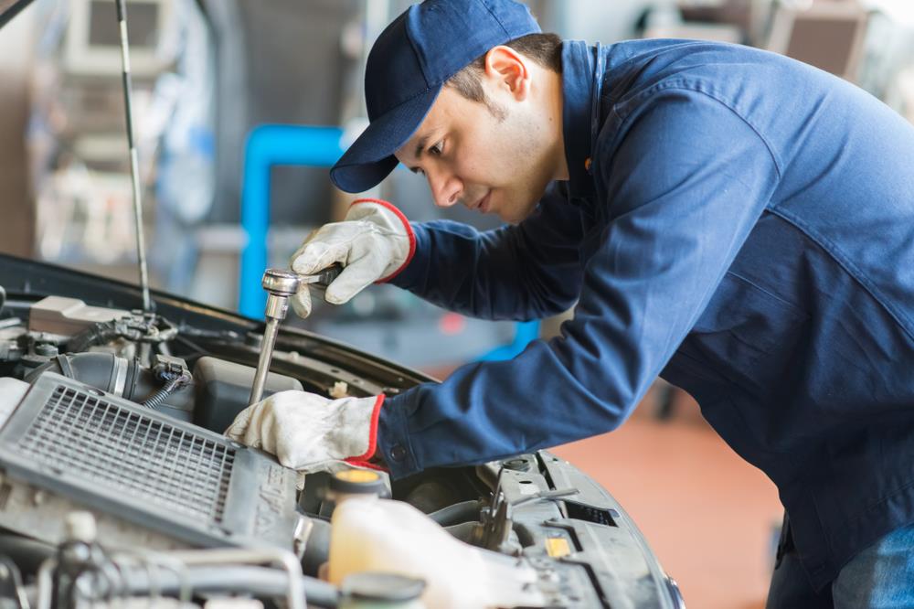 automotive technician working on a car