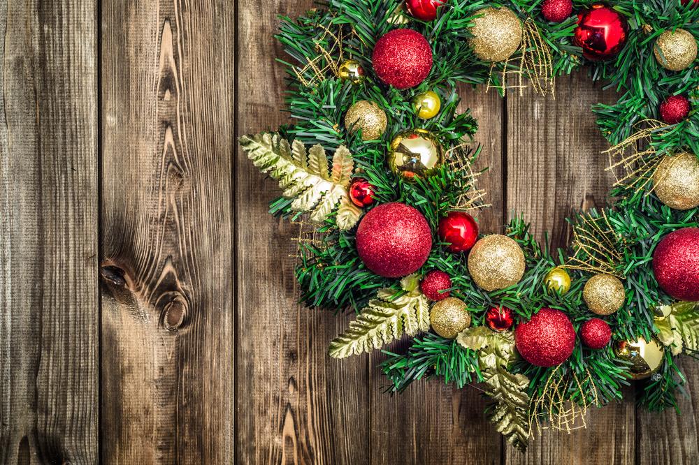 Christmas wreath resting on a wooden table