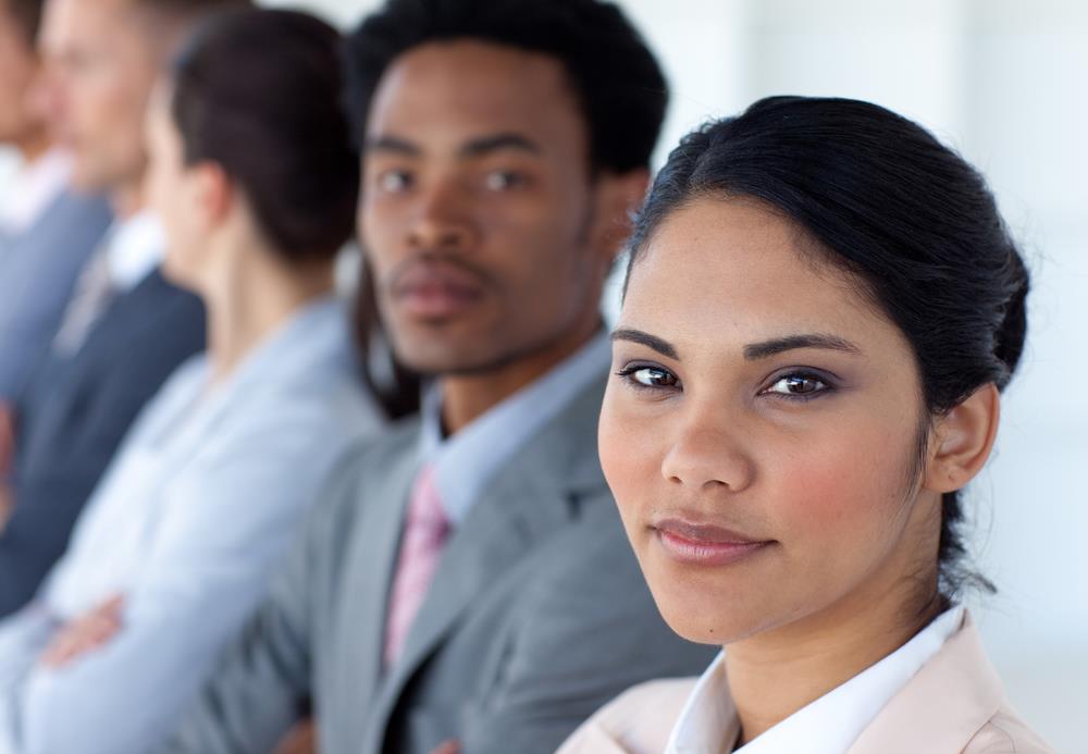 Young professionals looking into the camera