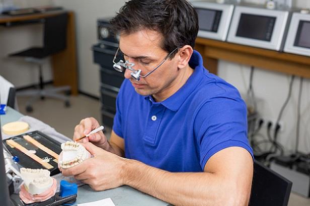 Dental laboratory professional hard at work