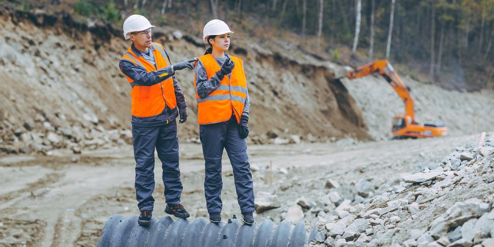 two construction team members on a job site