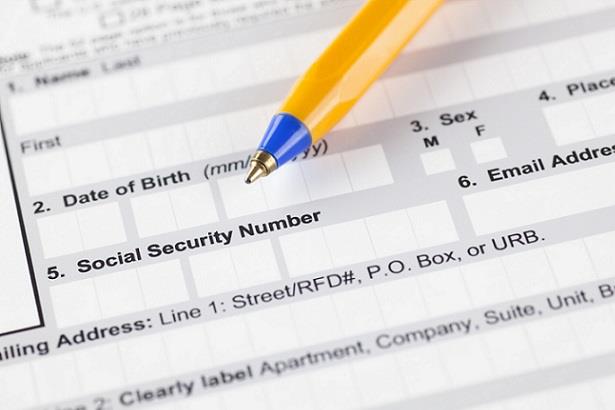 Closeup view of employment form showing field for social security number