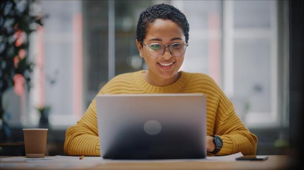 Recruiter writing job ad on computer