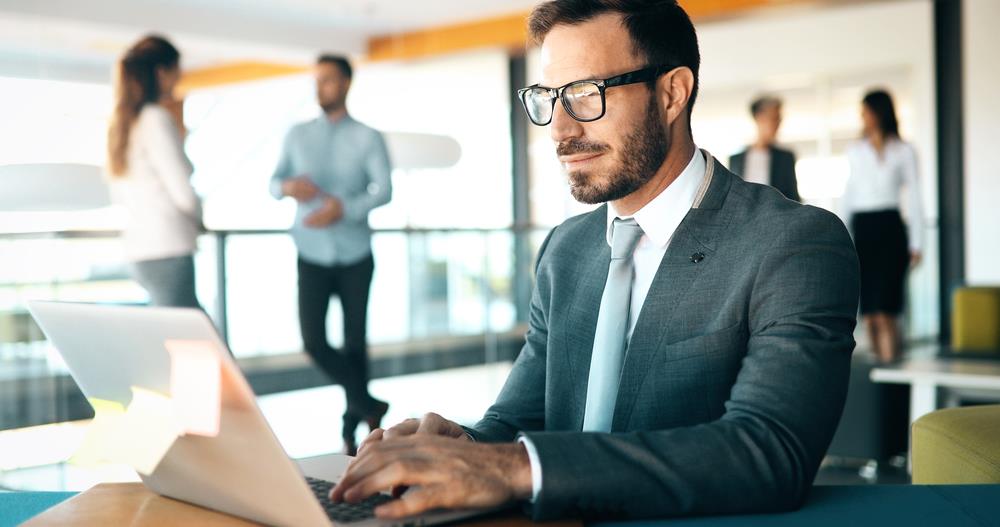 job seeker writing an email after a networking event