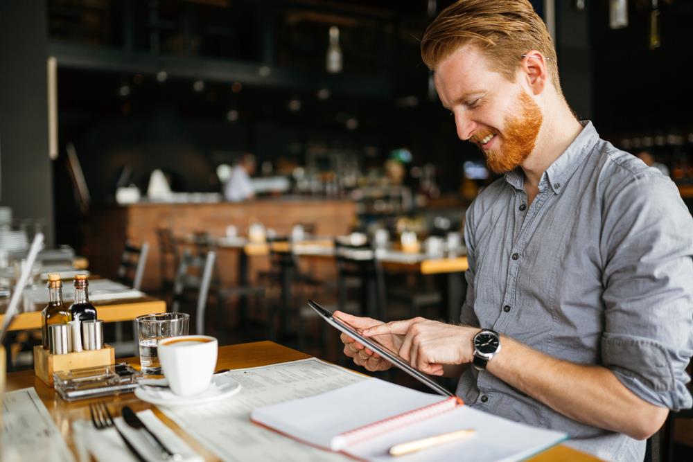 job seeker compiling his notes after a networking event