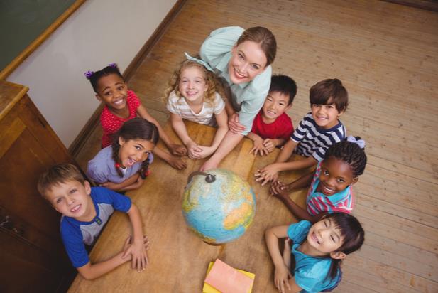 teacher with kids and globe