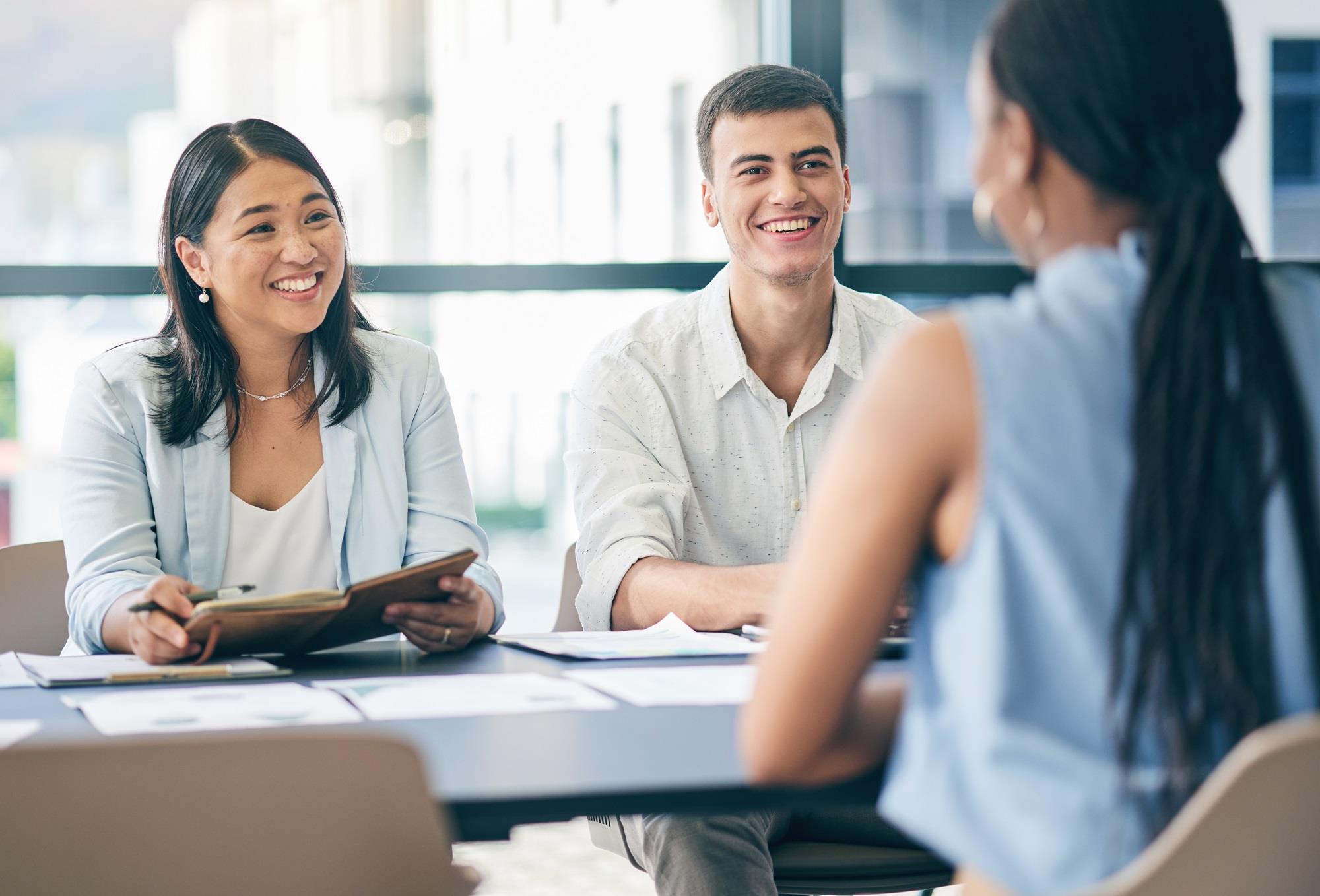 two employees interviewing a candidate