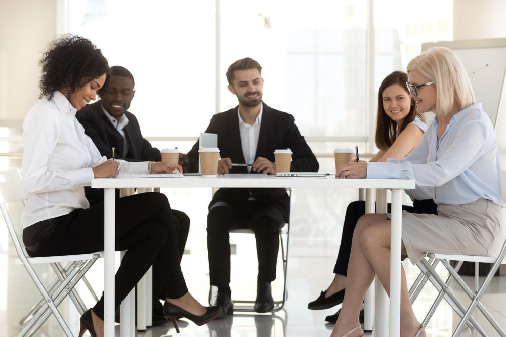 team of legal professionals working together at a table