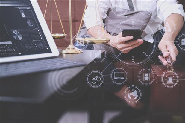 lawyer on his phone at his desk with various icons overlaid graphically