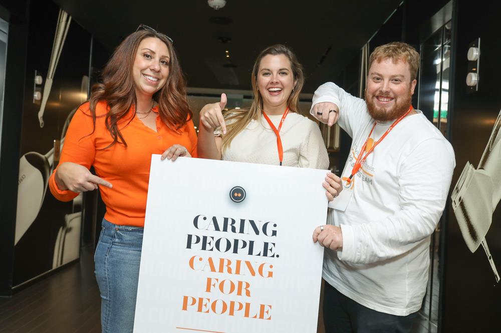 North American Dental Group photo of people holding sign