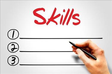 hand writing writing a list under the word "skills"