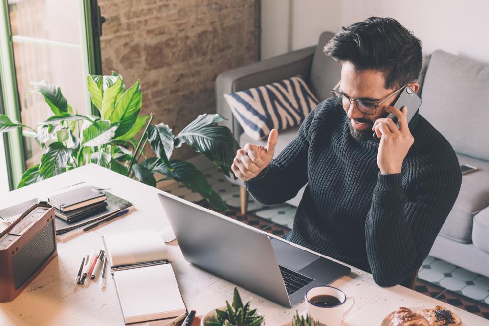 Man happy at computer