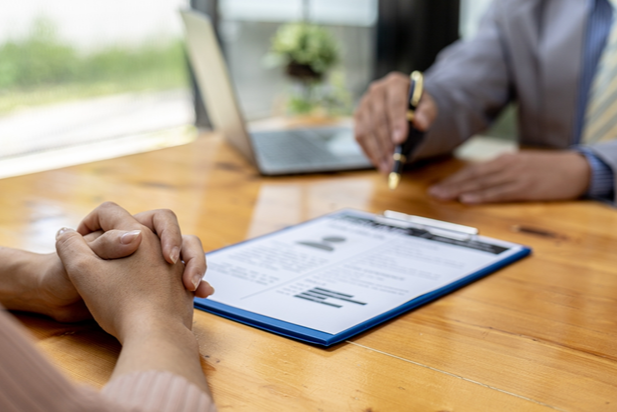 employer reviewing a resume with an applicant