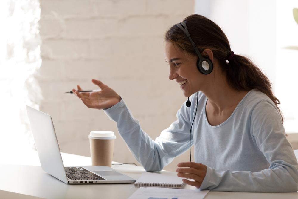 Transitioning employee having virtual meeting with outplacement specialist 