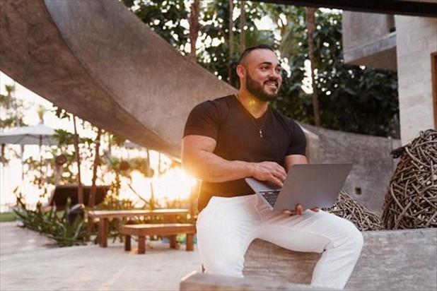 Man working on laptop outside