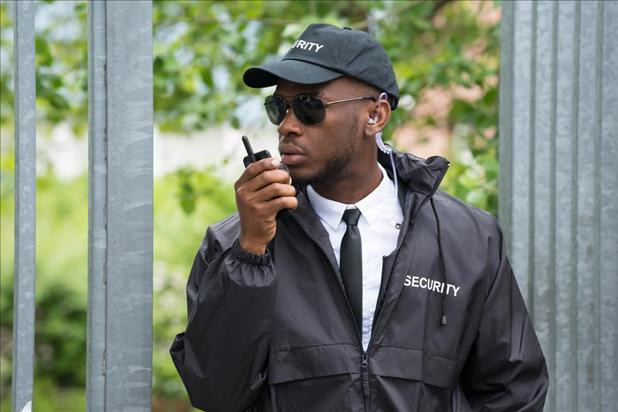 security officer on walkie talkie