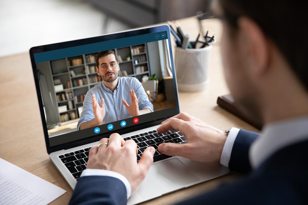 job seeker interviewing for a remote position on his laptop