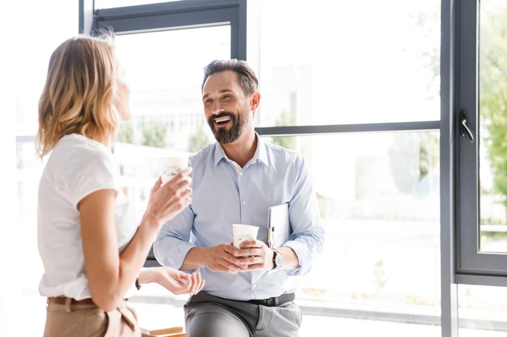 Happy employees laughing