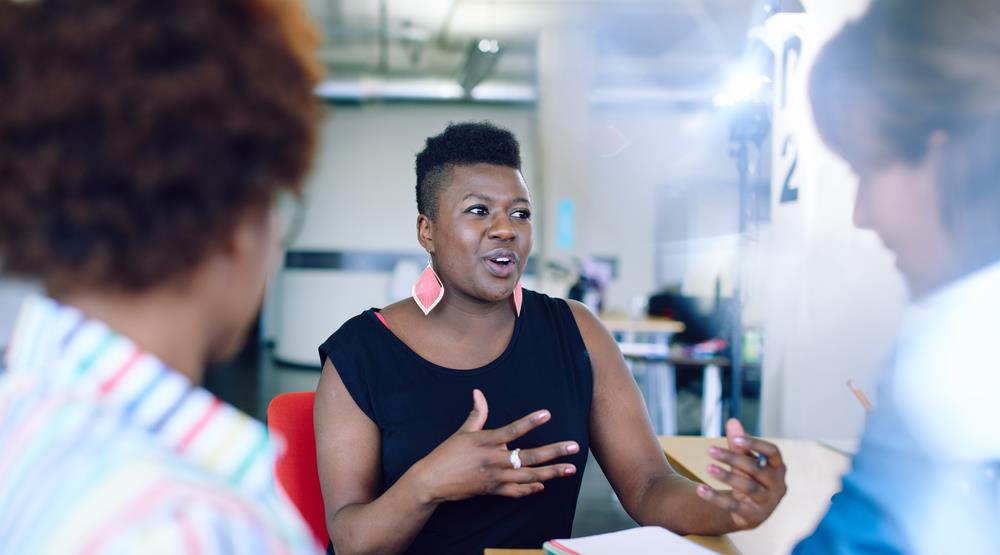 A woman speaking during an interviewing. 