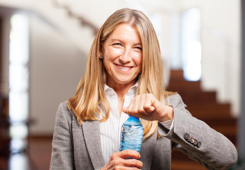 woman holding a water bottle