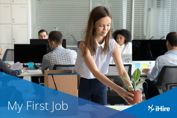 new hire setting up her desk at her first job