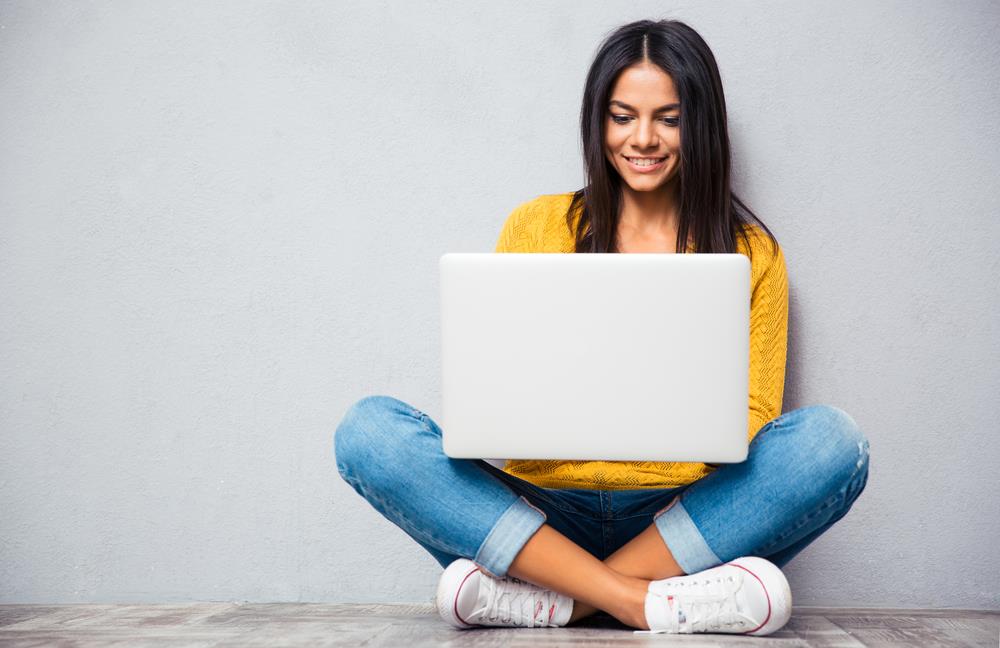 Woman on laptop attending virtual career fair