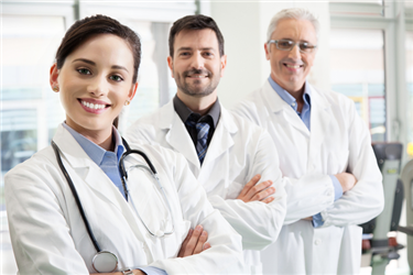 Medical professionals pose in a clinic