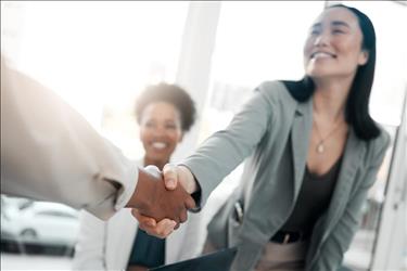 healthcare job seeker shaking hands with a possible employer